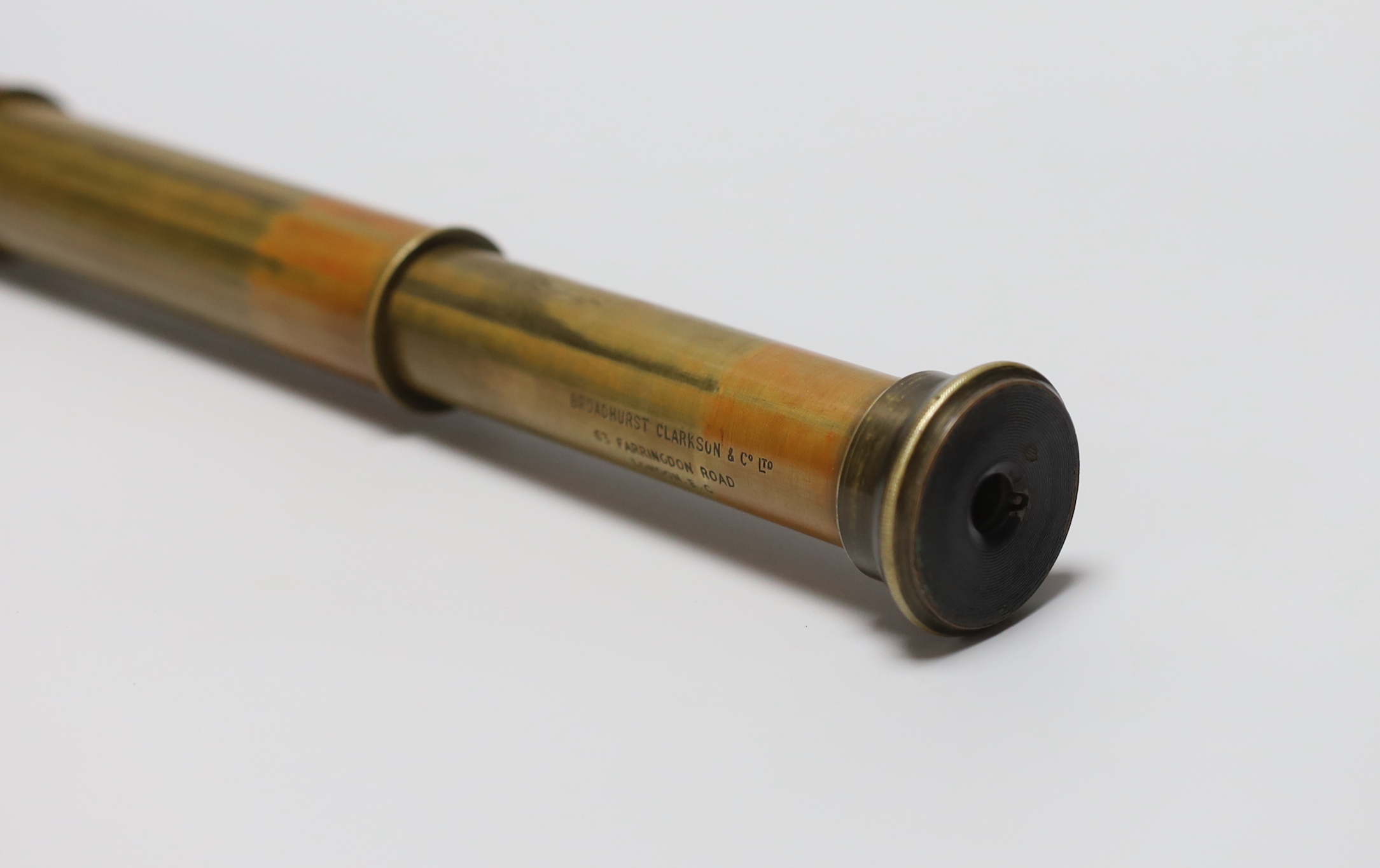 A Broadhurst Clarkson & Co Ltd brass and leather three draw telescope
